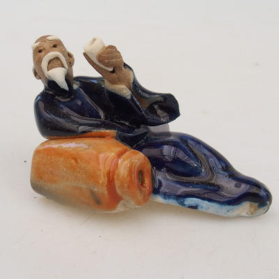 Ceramic figurine - lying sage - 1